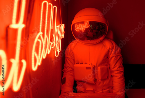 Anonymous astronaut sitting in cafe photo