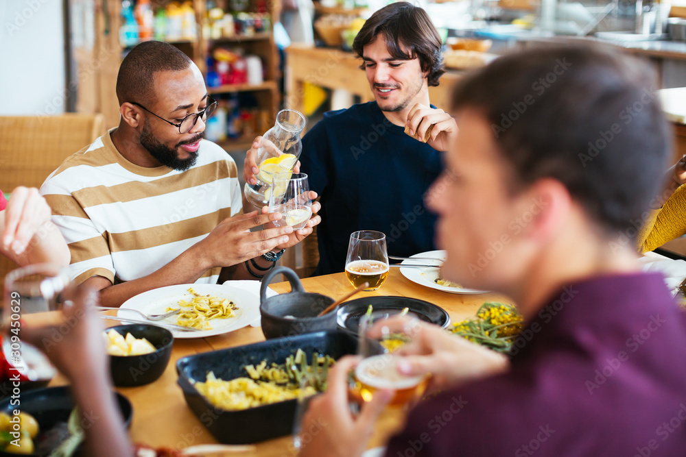 Friends having fun at a dinner party. Friends having fun at a dinner party.