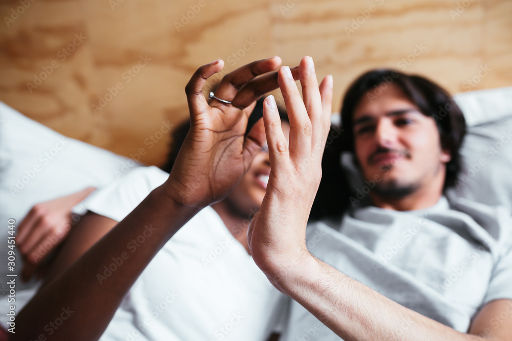 Multiethnic lovers on bedroom. Multiethnic lovers on bedroom.