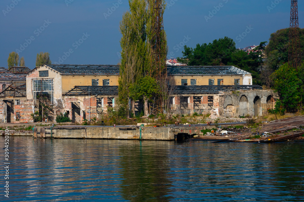 Old and abandoned building on Golden Horn waterway (Altın Boynuz or Halic). Istanbul, Turkey