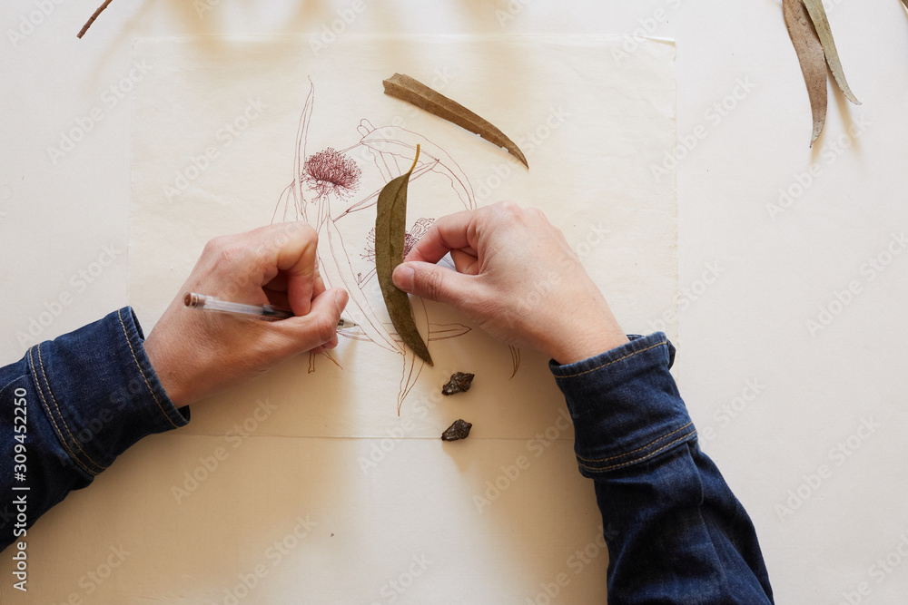 © Miquel Llonch/Stocksy - Artist hands at work