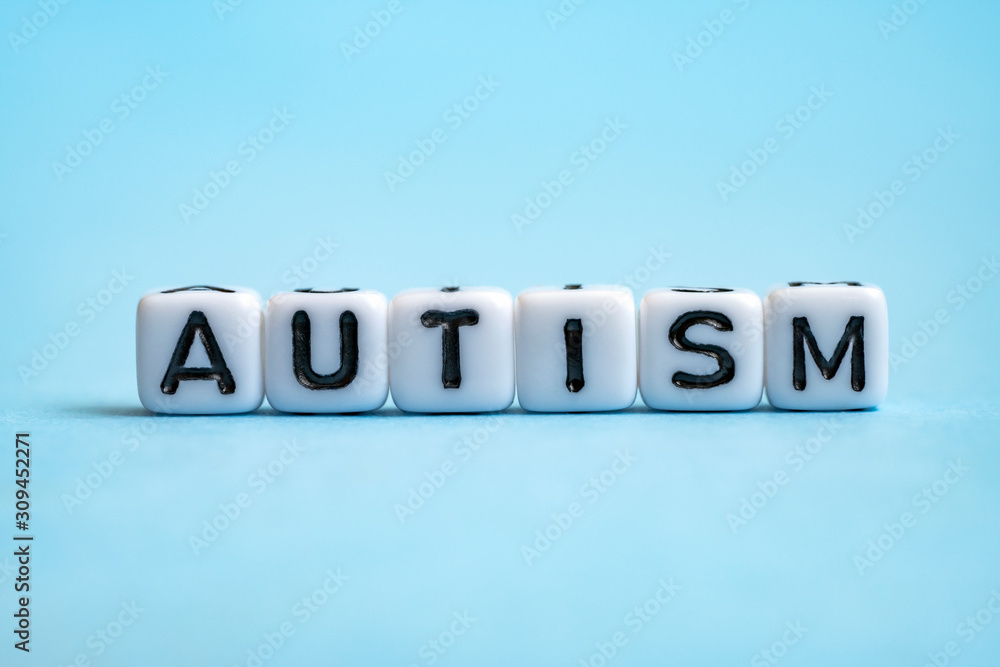 Autism spectrum disorder (asd). Word autism written on cubes on blue background. World autism awareness day. Healthcare concept. Autism spectrum disorder (asd). Word autism written on cubes on blue background. World autism awareness day. Healthcare concept.