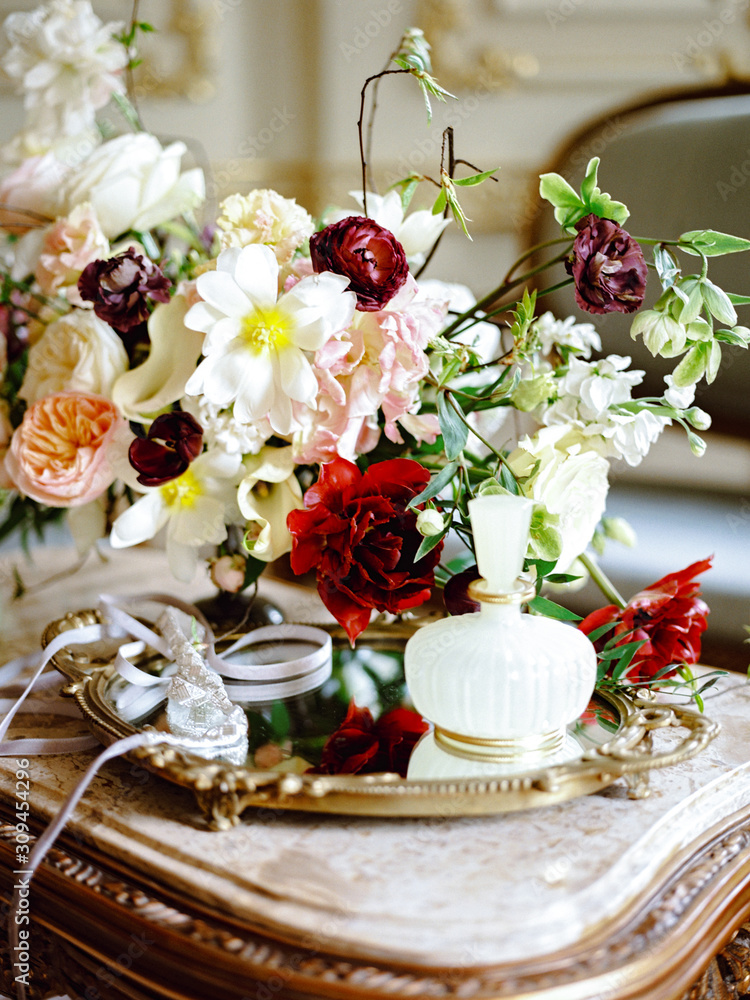Flower composition on table in classic interior Flower composition on table in classic interior