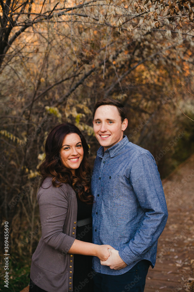 Couple smiling on autumn boardwalk Couple smiling on autumn boardwalk
