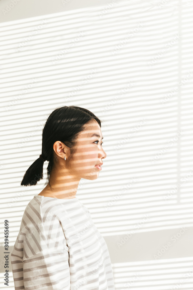 Artistic portrait of asian female with light and shadow Artistic portrait of asian female with light and shadow