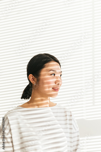 Artistic portrait of asian female with light and shadow photo