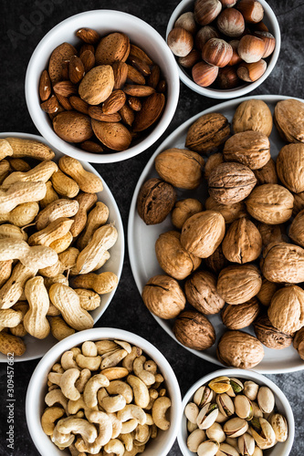 Various sort of nuts on the table photo