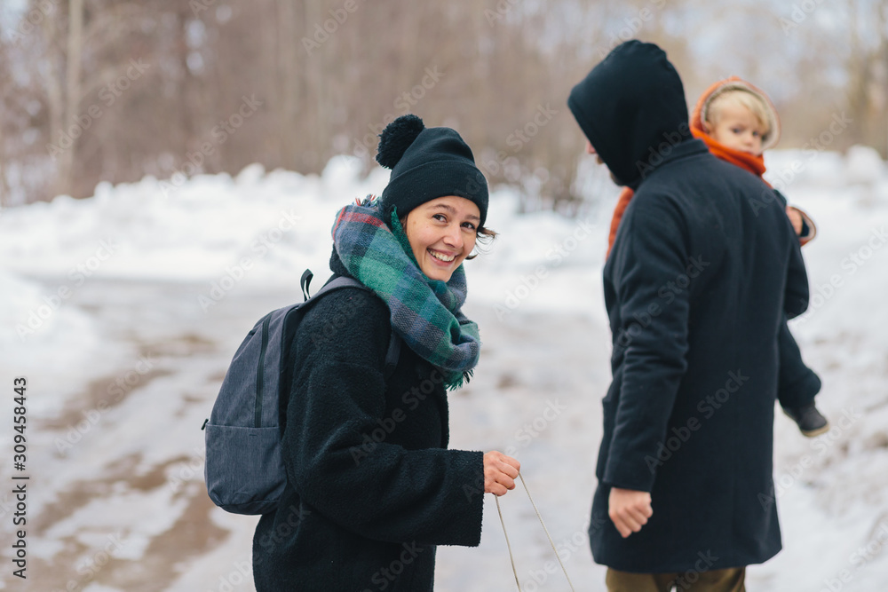 Parents and little boy on winter walk Parents and little boy on winter walk