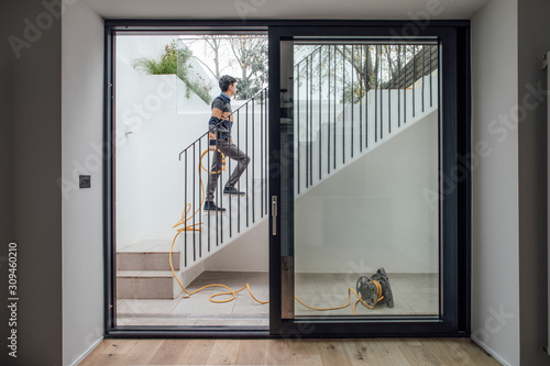 Man Holding Yellow Hose