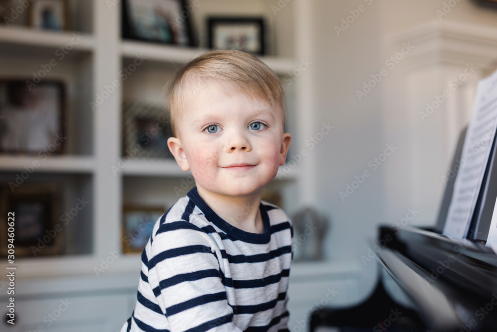 portrait of a toddler at a piano portrait of a toddler at a piano