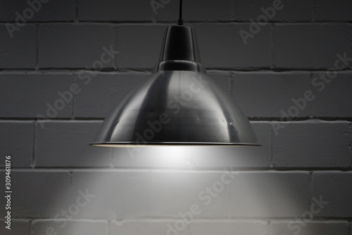 Wallpaper Mural metal lamp shines on a brick Torontodigital.ca