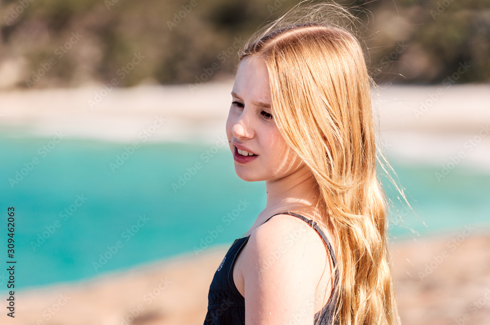 Pre-teenage girl playing at the beach Albany Western Australia