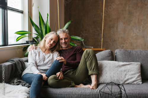 Couple enjoying time together in loft condo home. photo