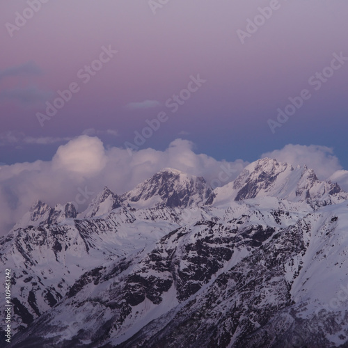 Snowy mountain peaks beautiful landscape at sunset