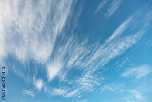Scenic fluffy cirrus and stratus clouds in the blue sky