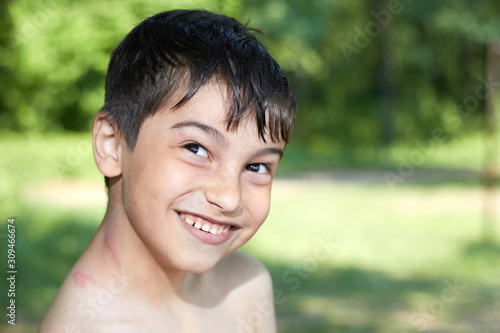 portrait of a small happy joyful boy smiling