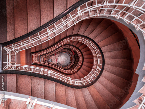 Stairs in spiral shape with a with to the roof