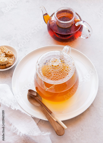 Pots of brewing tea photo