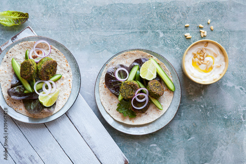 Spinach falafel wrap with cucumber and lettace
