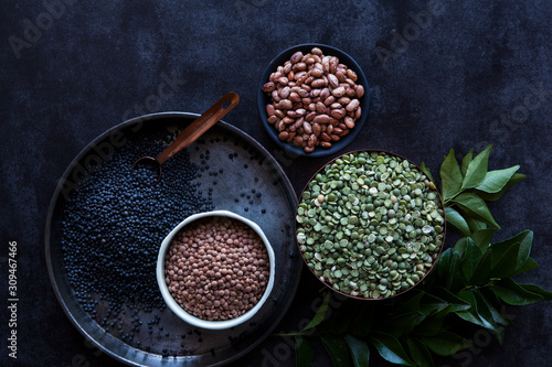 A variety of pulses and curry leaves photo