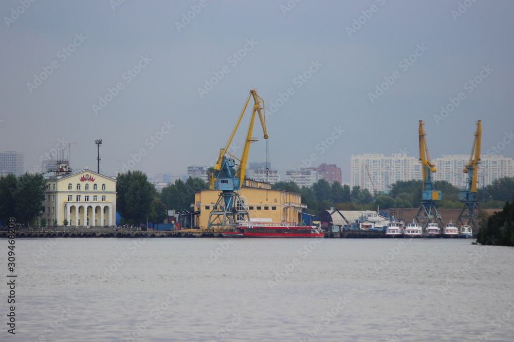 Moscow river Cargo South Port Cranes on Summer evening, view from water