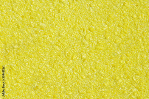 Sponge Texture of yellow color closeup.