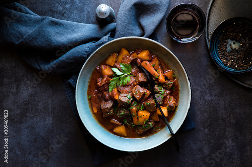 Bowl of hearty beef stew with vegetables photo