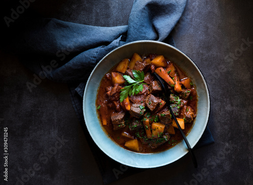 Bowl of hearty beef stew with vegetables