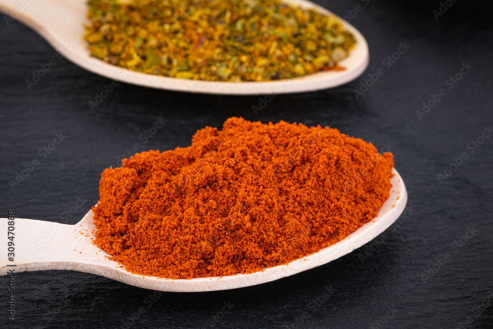 Colourful various herbs and spices on dark background Colourful various herbs and spices on dark background