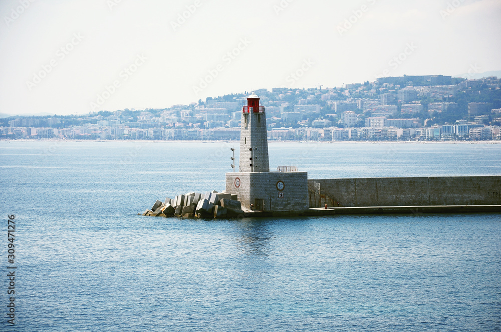 Lighthouse by the city port. Nice. France.