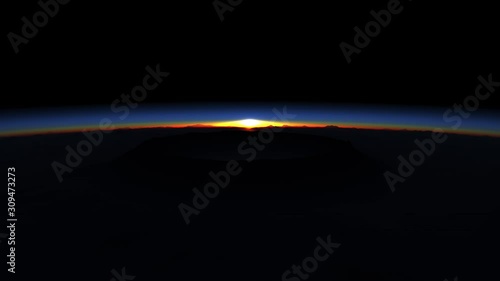 Beautiful plan with the sun rising above the horizon of the planet. The atmosphere glows with amazing light.