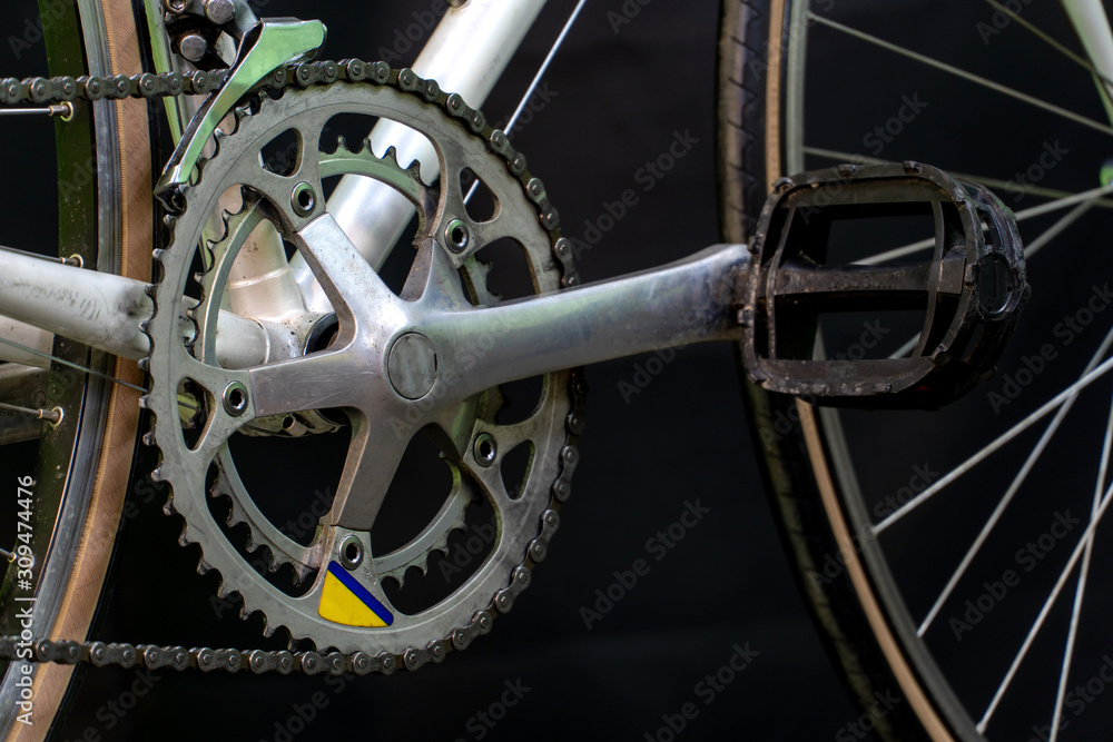 Grodno, Belarus, February 14, 2019: Repair road bike. Photo in the Studio on a black background. Restoration of an old racing bike. Broken parts close up.