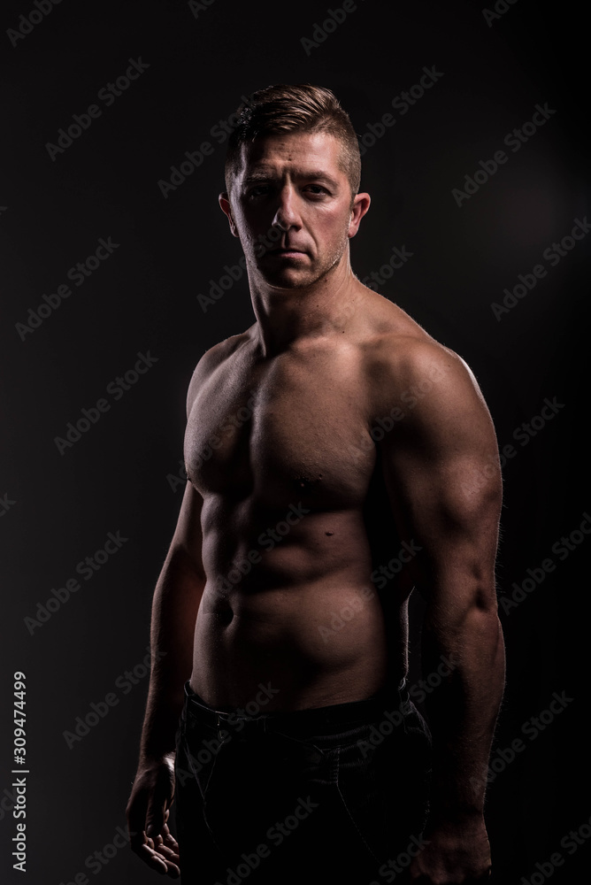 Strong Athletic Man Fitness Model Torso showing big muscles over.
