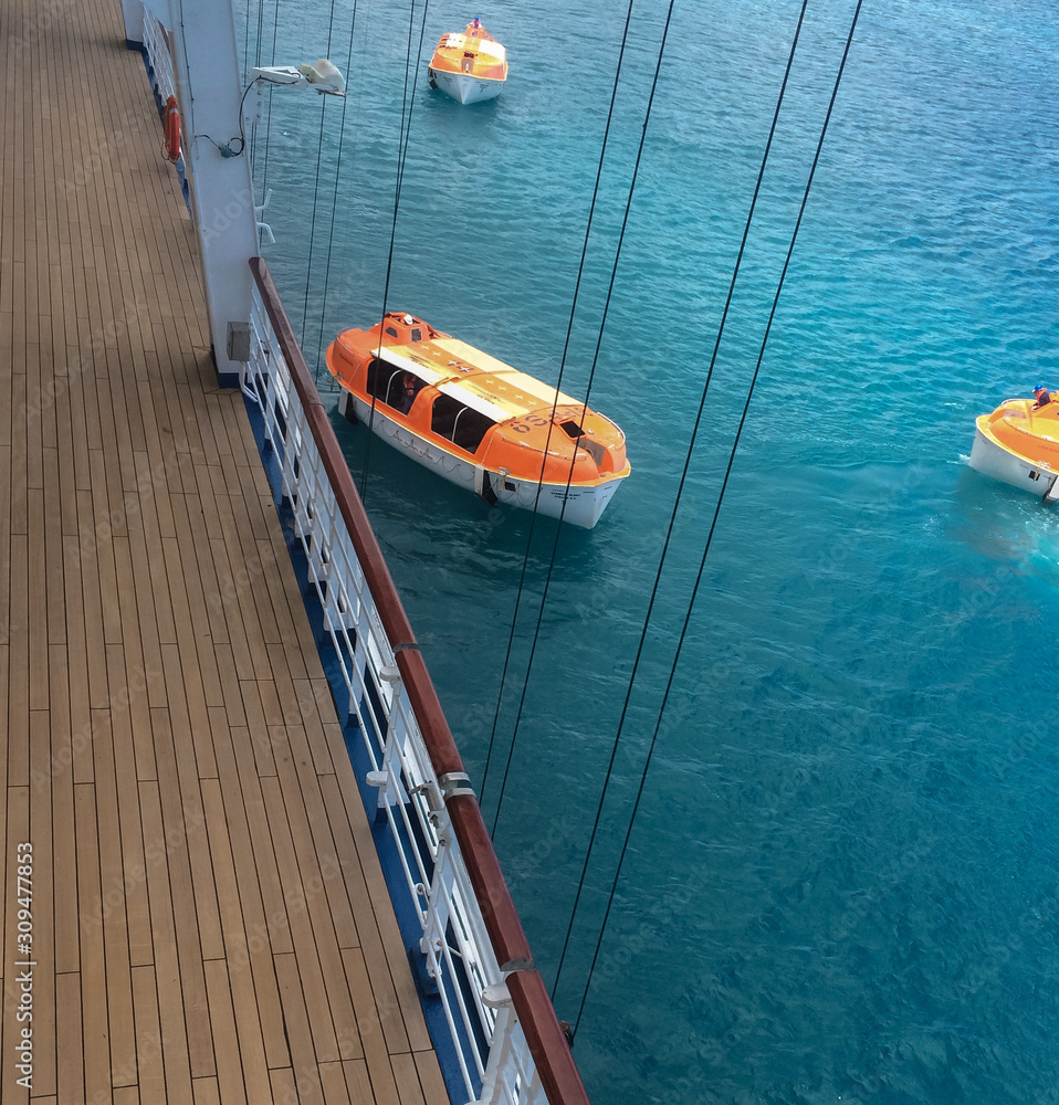 Obraz premium St Thomas, Caribbean Feb 2015 A lifeboat or life raft is a small, rigid or inflatable boat carried for emergency evacuation in the event of a disaster aboard a ship.Lifeboat drills are required by law