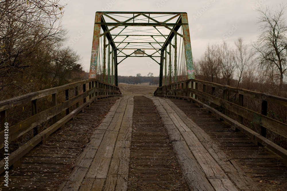 Fototapeta premium Old wooden bridge over the creek