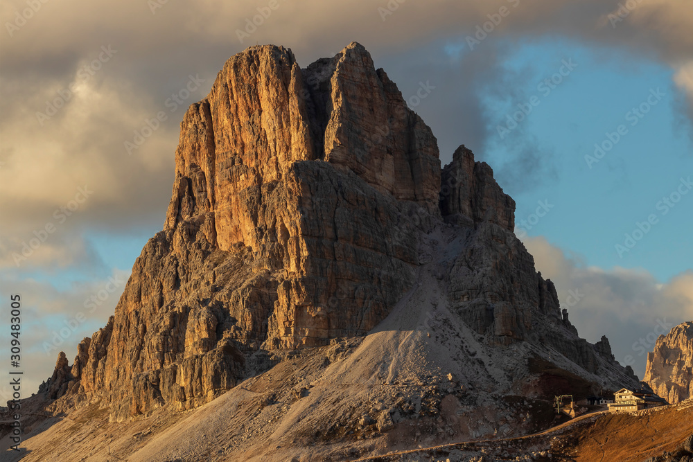 Dawn over Passo Giau in the Italian Dolomites. Blue sky with rising sun.