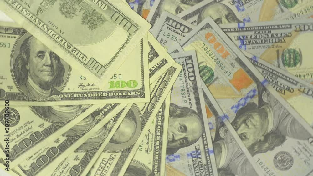 Top down view of rotating one hundred dollar white black cartoon comic money bills. Close Up Shot. Top down view of rotating one hundred dollar white black cartoon comic money bills. Close Up Shot.