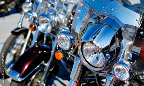 Modern motorcycle headlights close up view outdoors, part of vehicle front view © Alex Tihonov