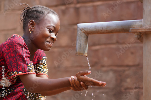 African Black Boy Washing His Head with Fresh Clean Water
