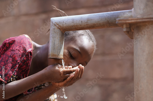 Couple of Black African Children Drinking Water from tap  Human Rights  Poverty  Climate Change 