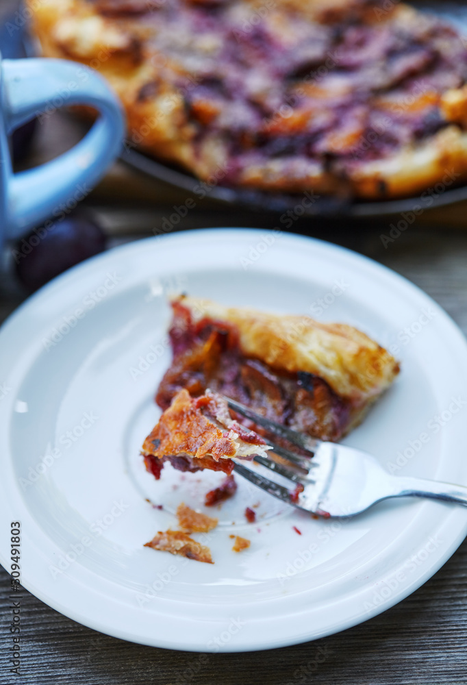 Delicious almond plum cake on puff pastry.