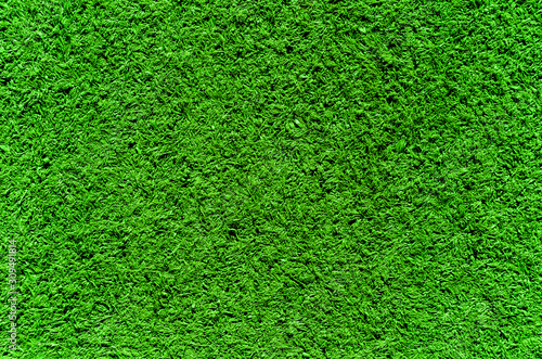 grass of the sports field cut short and trampled in intense green zoom on full frame