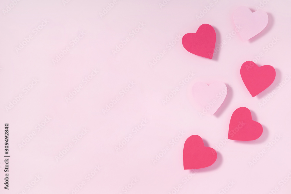 Valentine's day frame composition. Purple pink hearts on pastel pink background. Top view, flat lay, copy space