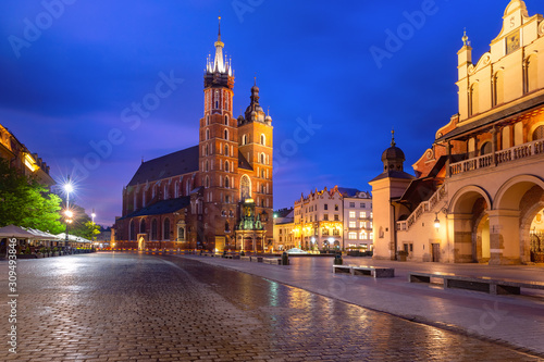 Medieval Main market square with Basilica of Saint Mary in Old Town of Krakow at sunrise, Poland