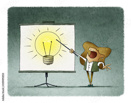 Businesswoman points on a display a large light bulb. creativity teaching con...