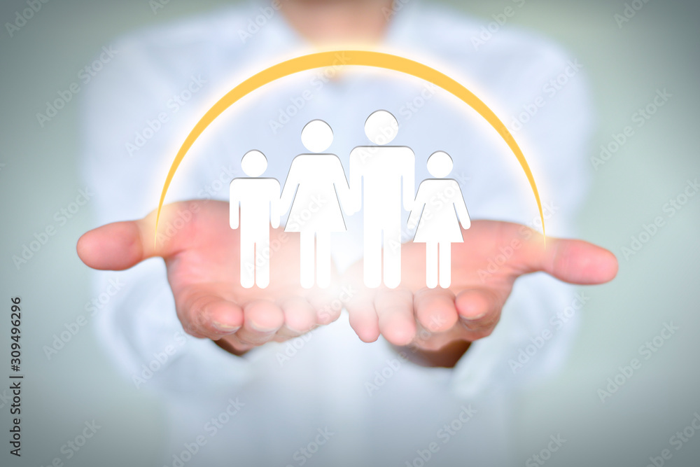 Closeup male businessman holding family of four, love and family relationship concept. Closeup male businessman holding family of four, love and family relationship concept.
