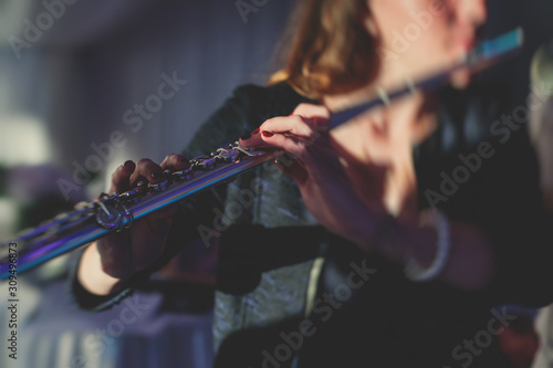 Photography Concert view of a flutist flute player with musical jazz band and audience in th
