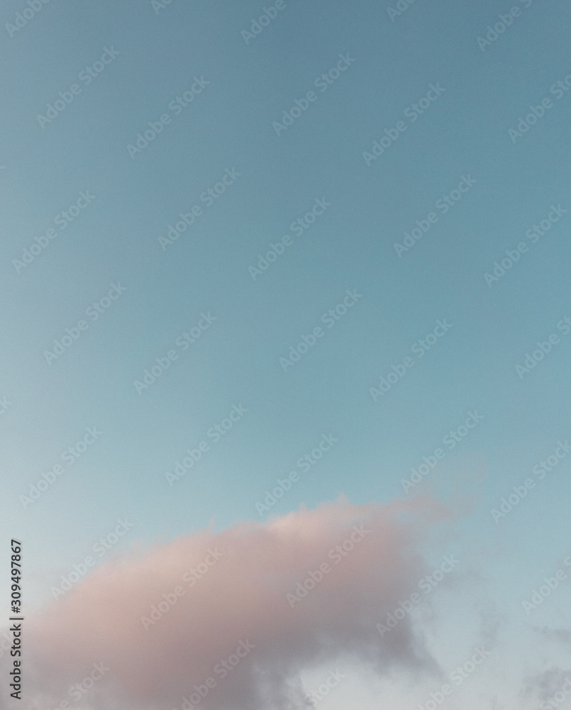 Blue sky with pink clouds at sunset in winter