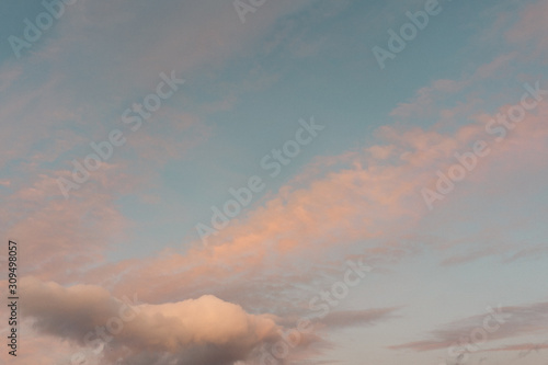 Blue sky with pink clouds at sunset in winter