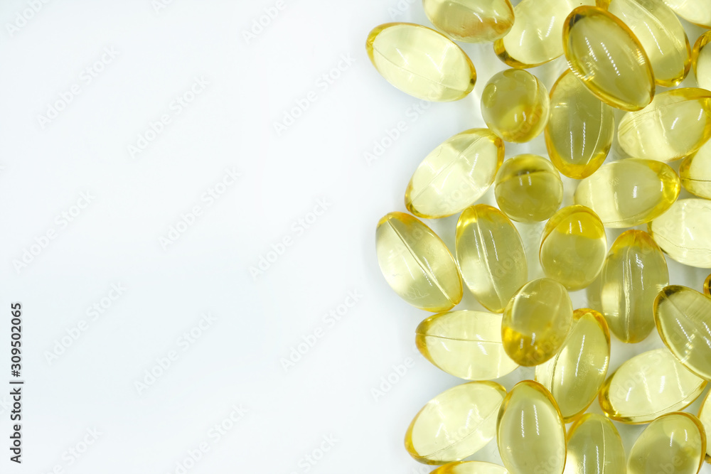 Yellow transparent capsules. capsules with vitamin E. Omega 3 capsules. Yellow transparent capsules. capsules with vitamin E. Omega 3 capsules.